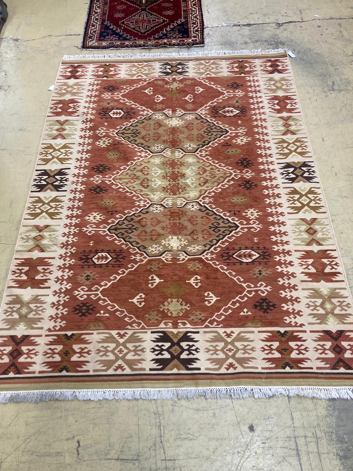 A geometric Kilim rug, 240 x 167cm